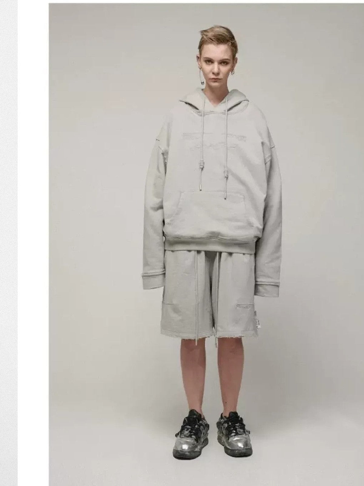 LOSTCTRL Embroidered Raw Edge Cotton Hoodie in Gray - On Model