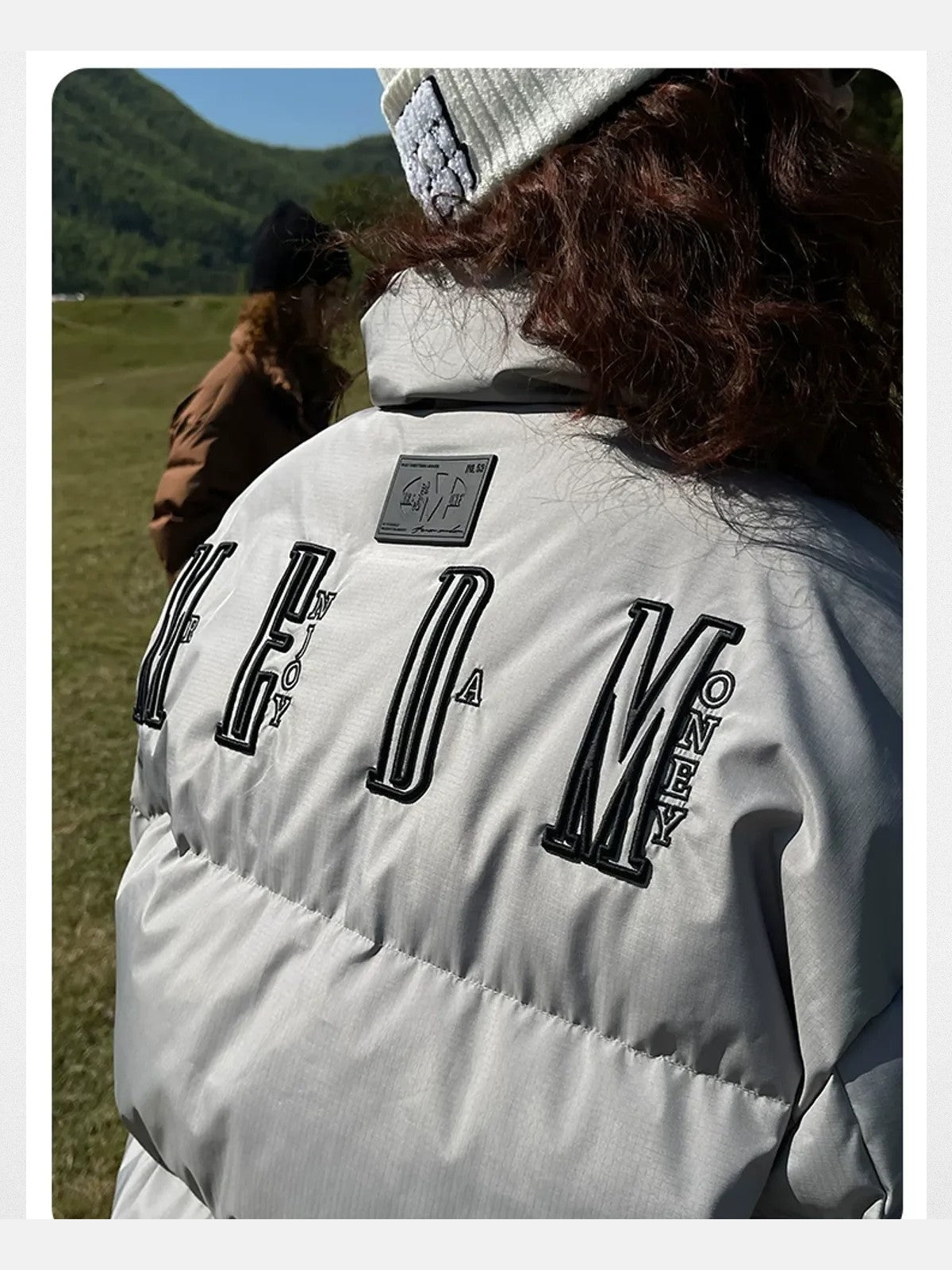 MEDM Embroidered Down Puffer Jacket in Gray - On Female Model