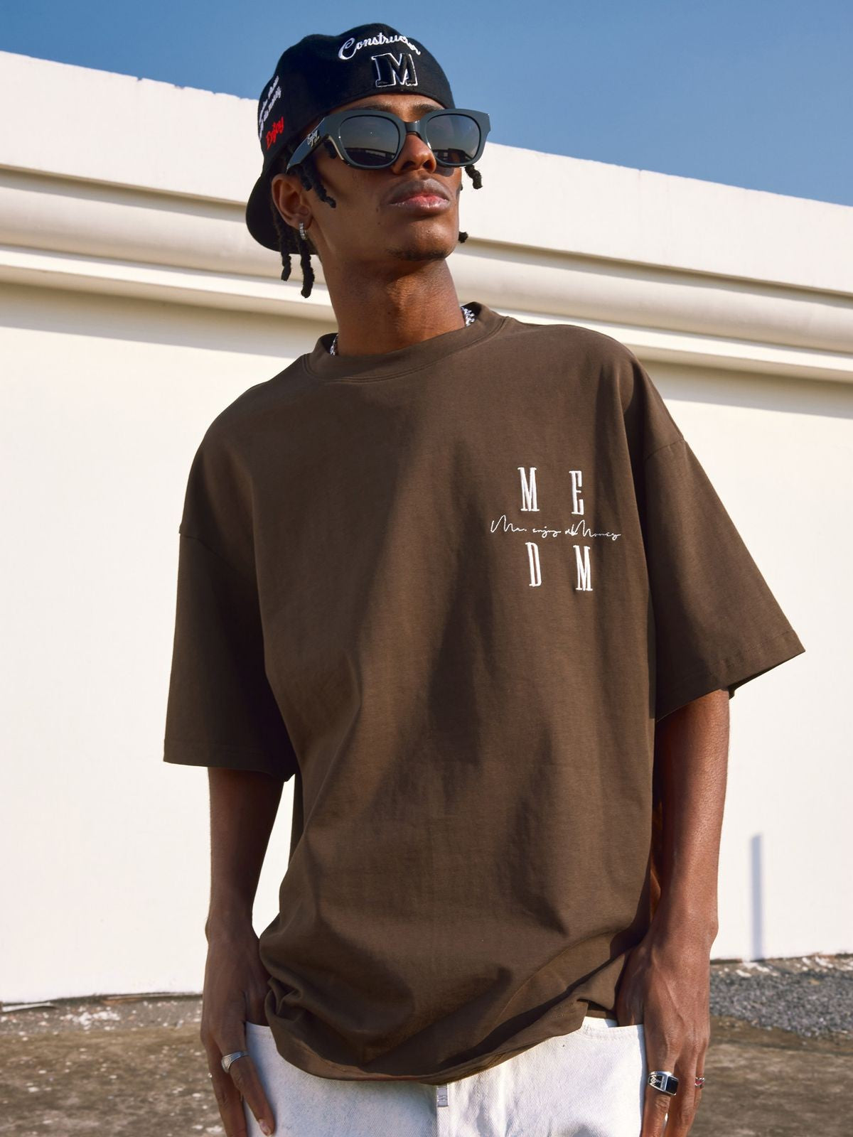 MEDM Oversized Logo Print T Shirt in Brown - Lifestyle