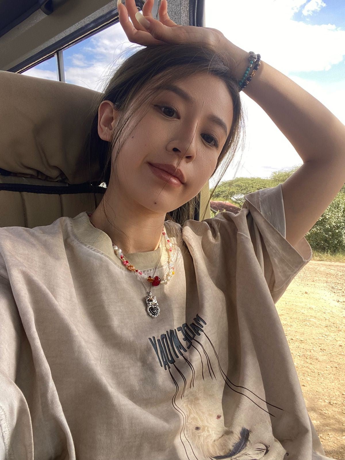 NeverSeez Garment Dyed Puppet Print Tee in Khaki - On Female Model