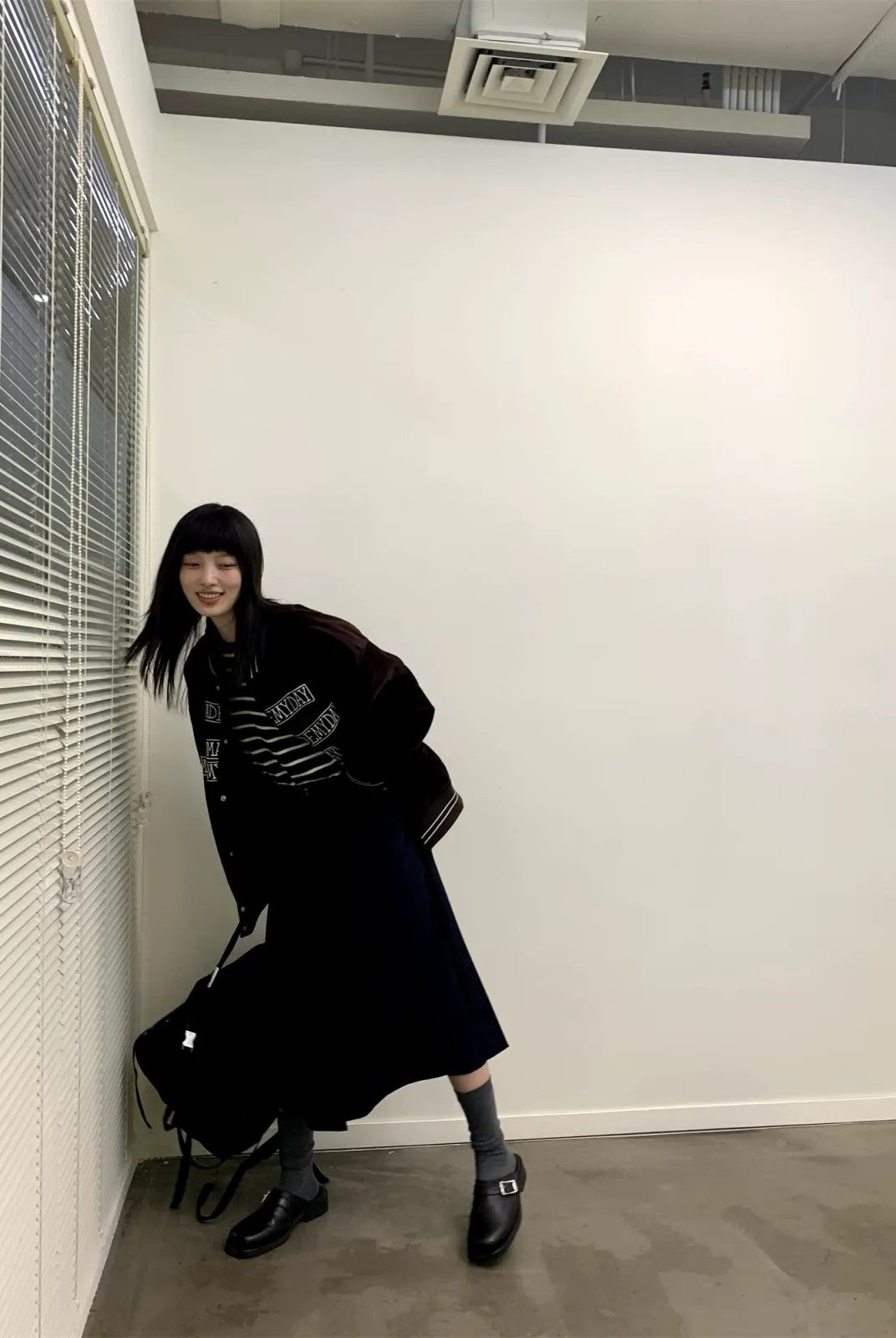 NeverSeez Velvet Corduroy Padded Varsity Jacket in Black - On Model