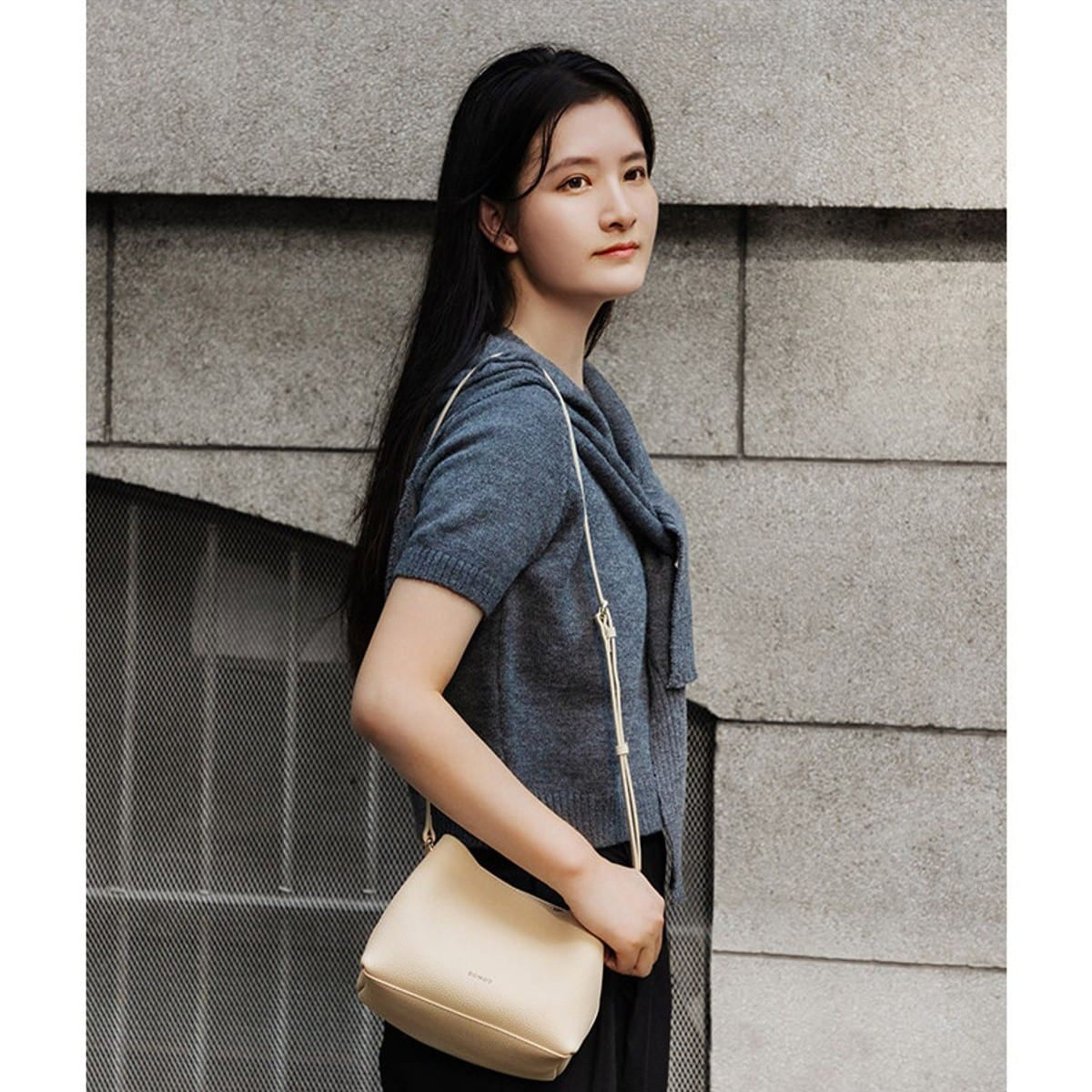 HONGU Textured Leather Top Handle Bucket Bag in Beige - On Female Model