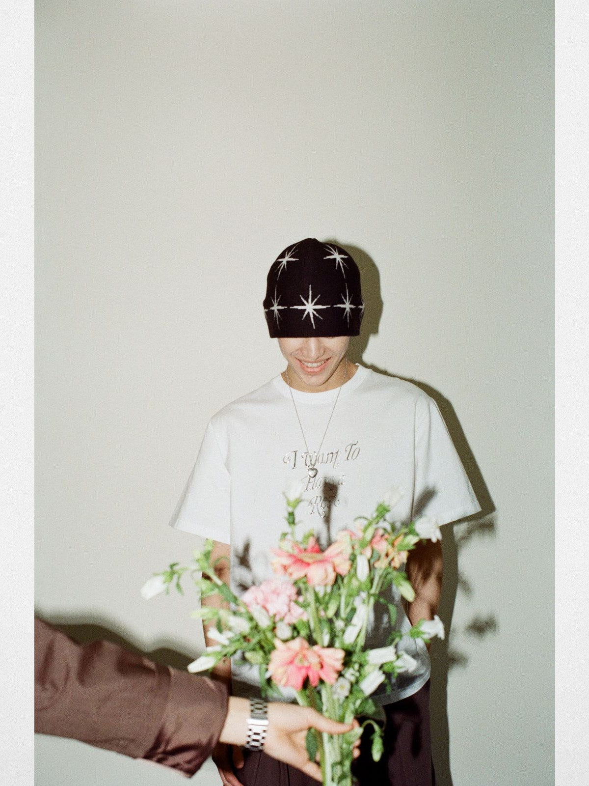 NeverSeez Embossed Script Cotton T Shirt in White - On Male Model