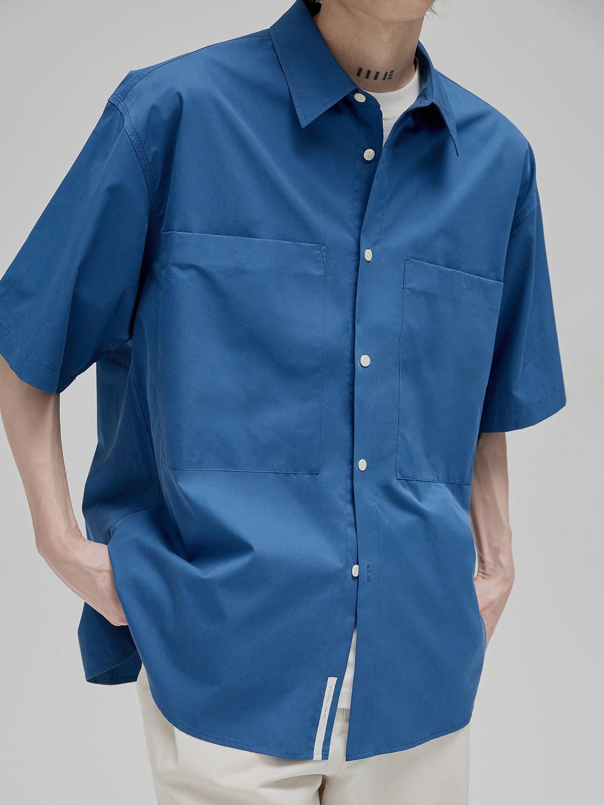 NANS Sand Washed Cotton Curved Hem Shirt in Dark Blue - On Model