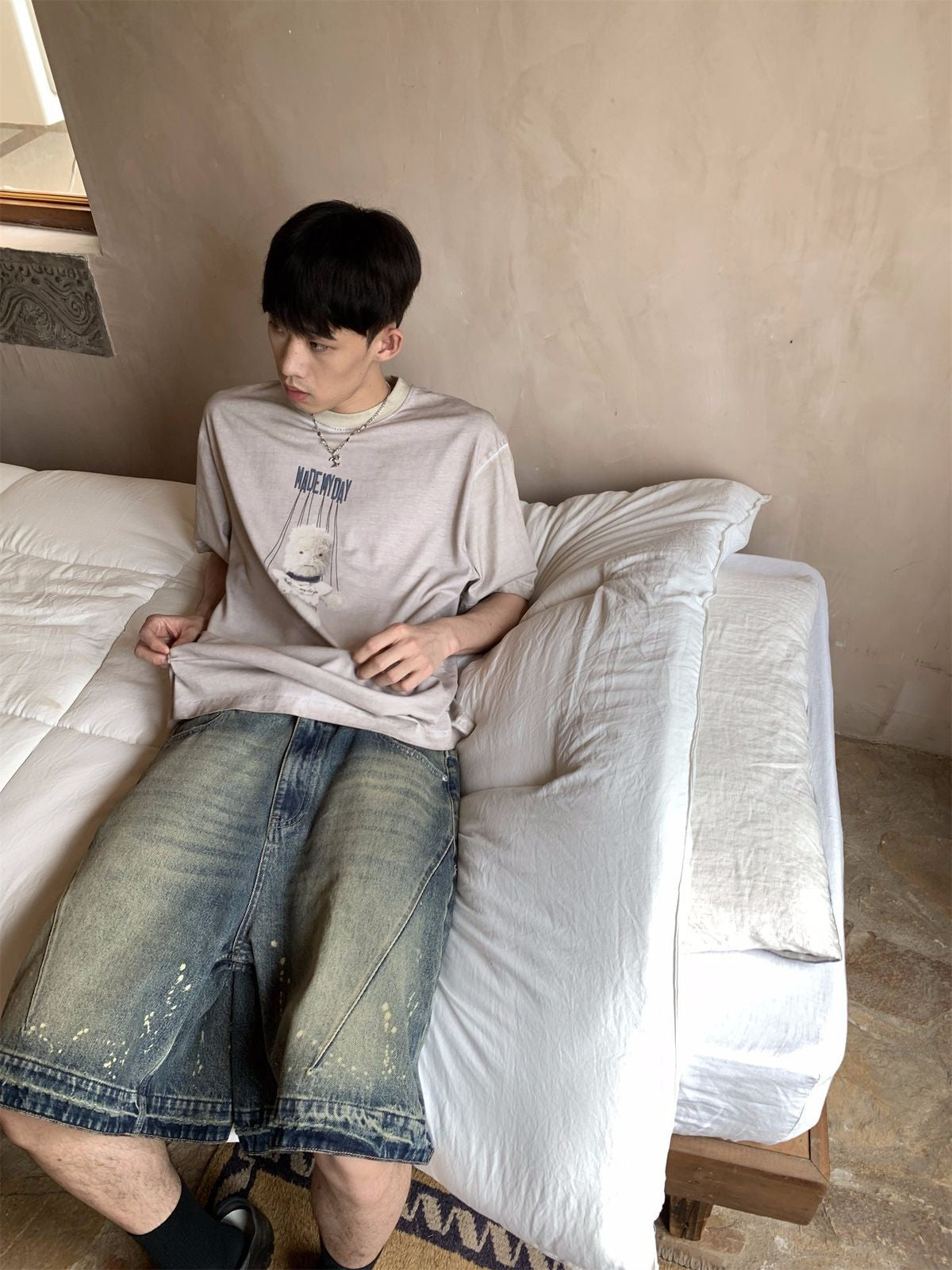 NeverSeez Garment Dyed Puppet Print Tee in Khaki - On Male Model