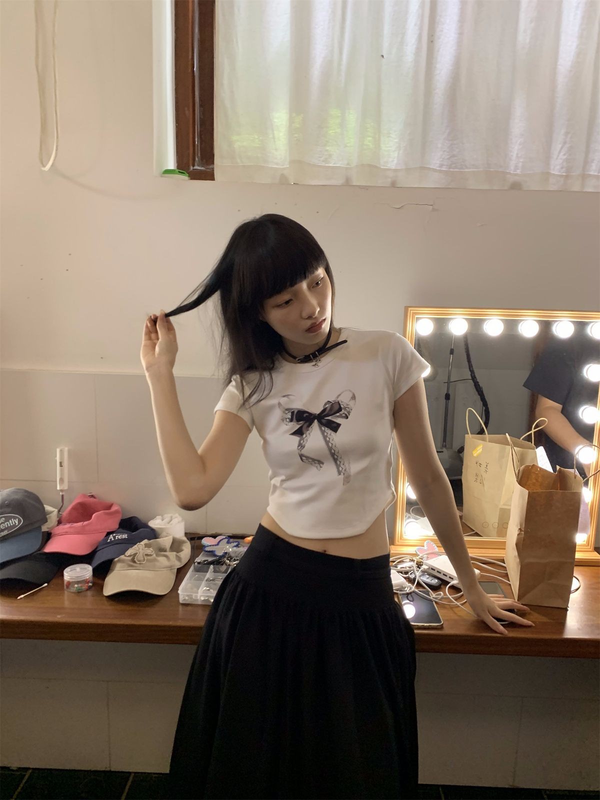 NeverSeez Lace Bow Graphic Baby Tee in White - On Model