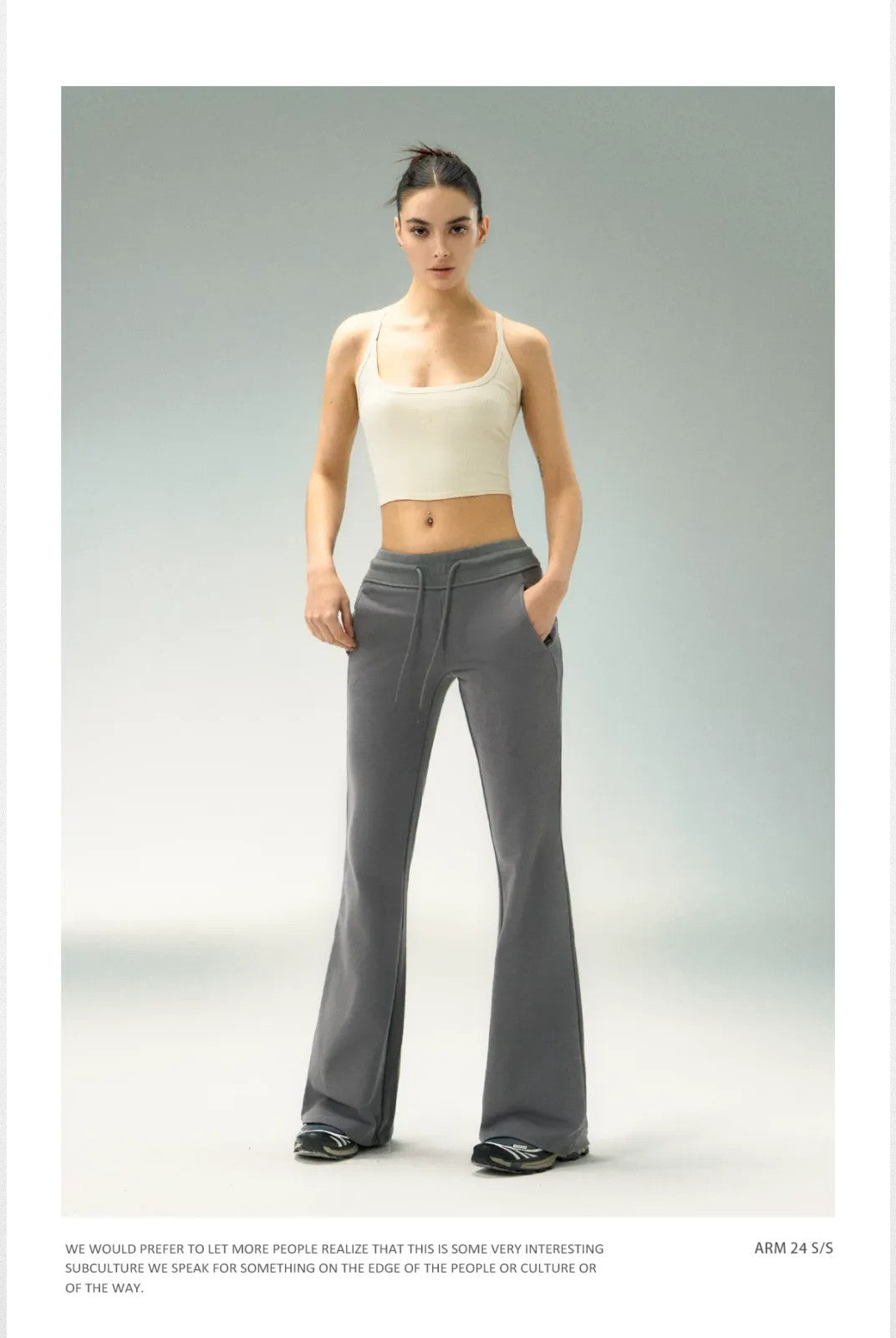 Ariseism Low Rise Micro Flare Sweatpants in Charcoal - On Model