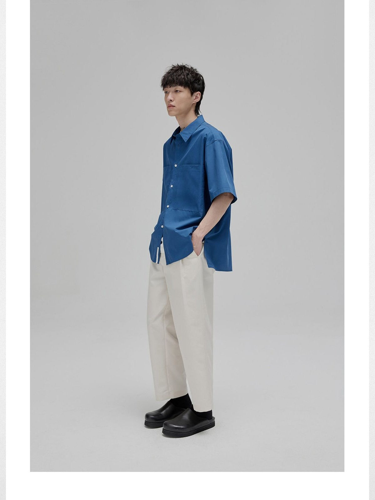 NANS Sand Washed Cotton Curved Hem Shirt in Dark Blue - On Model