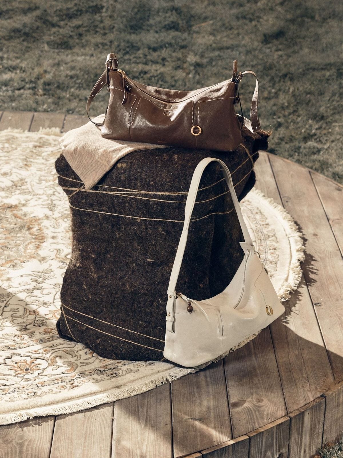 Songmont Vegetable Tanned Lambskin Pillow Hobo in Cream - Lifestyle