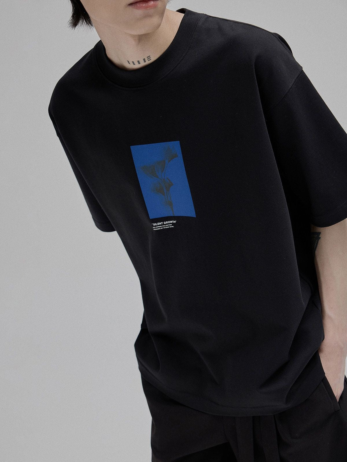 NANS Silent Growth Floral Print T Shirt in Black - On Model