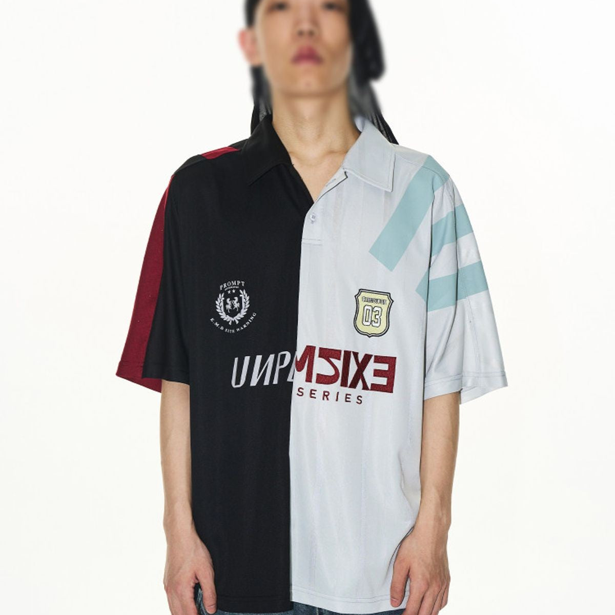 BLINDNOPLAN Split Panel Graphic Polo Shirt in Black - On Model