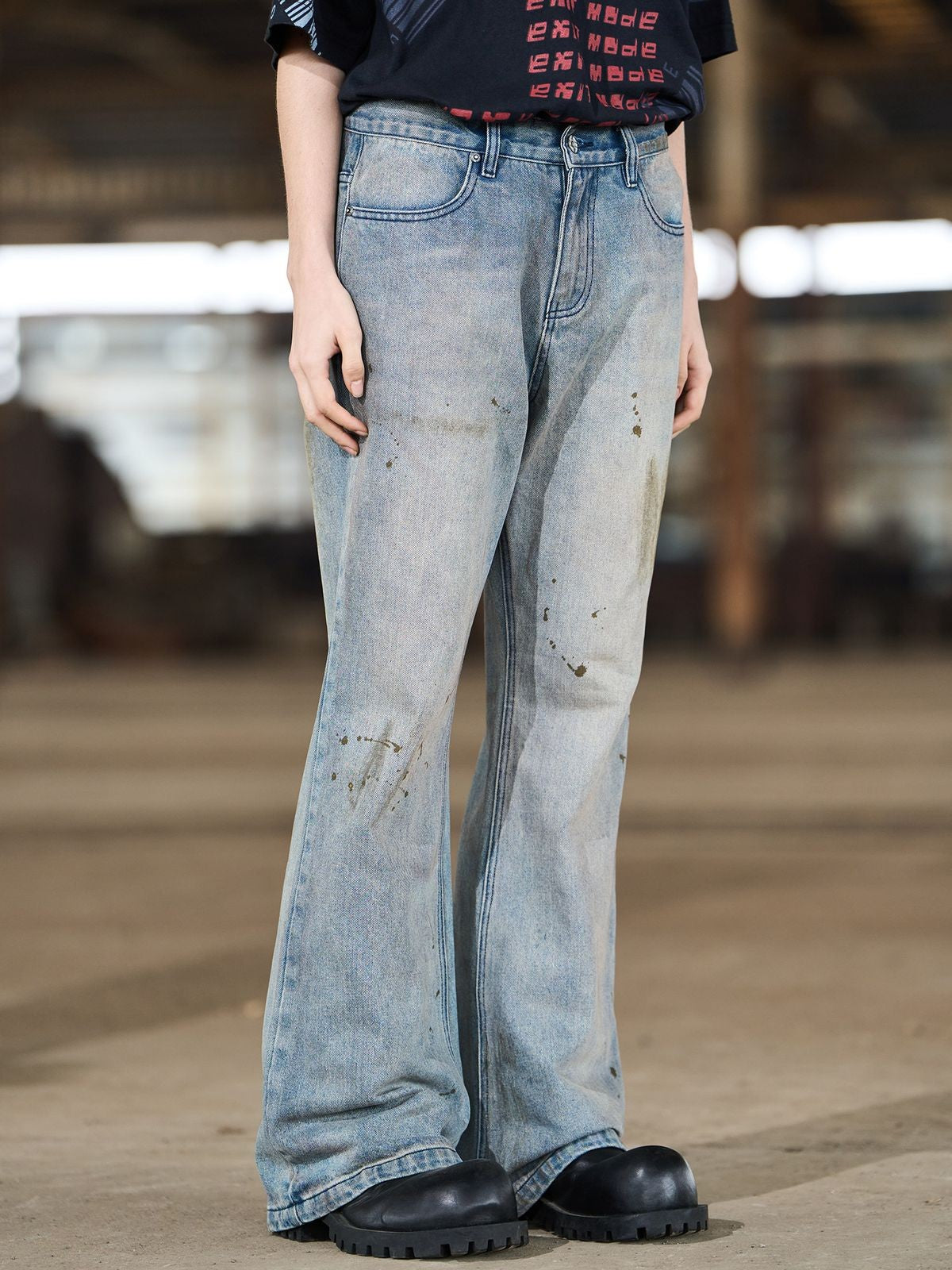 BLINDNOPLAN Distressed Ink Splatter Flare Jeans in Blue - On Model