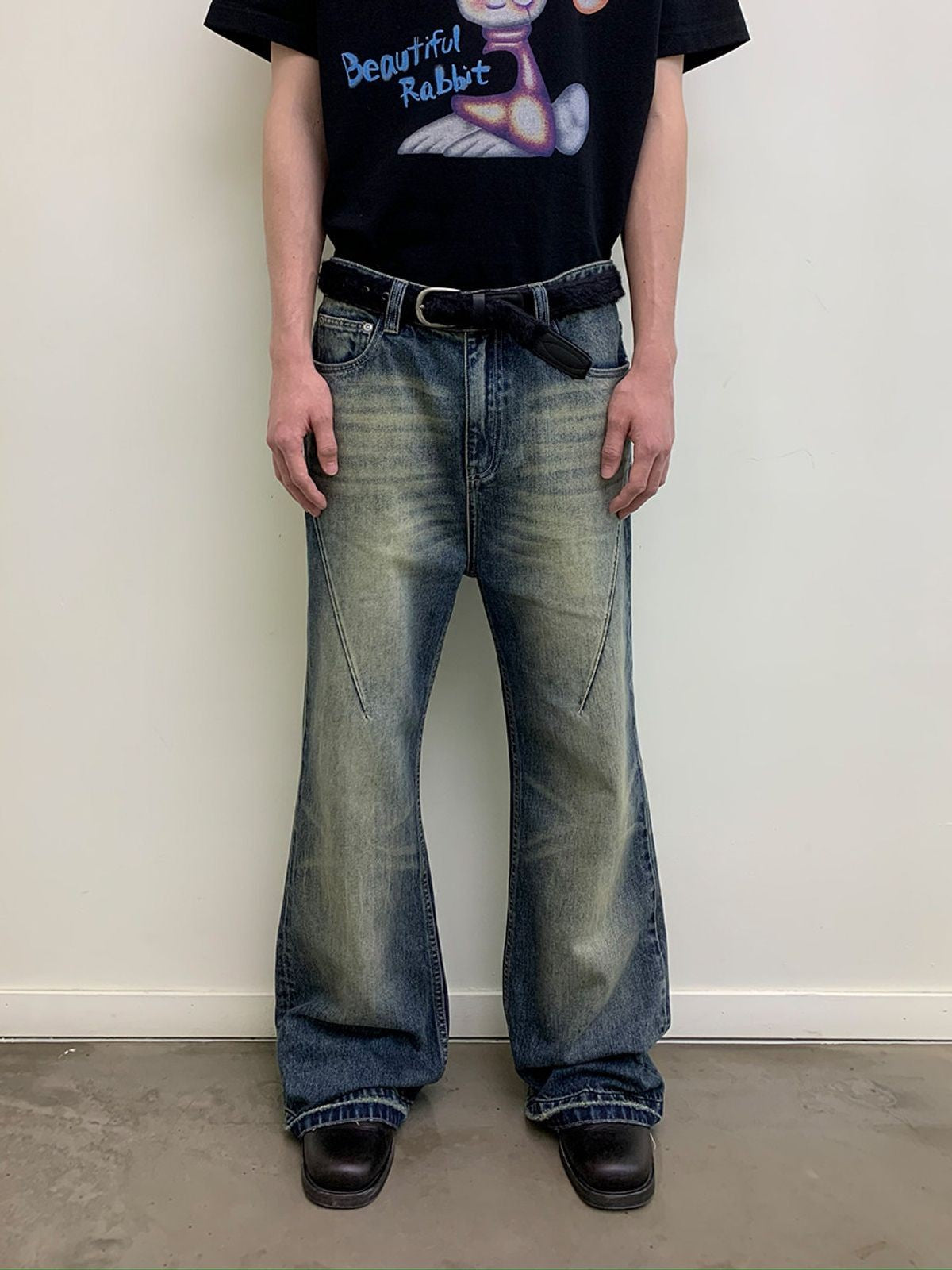 NeverSeez Distressed Washed Micro Flare Jeans in Blue - On Model