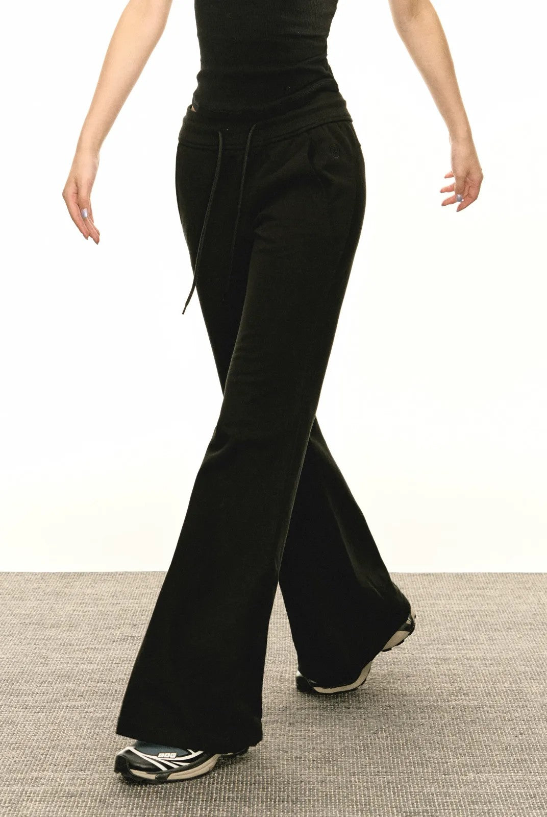 Ariseism Low Rise Micro Flare Sweatpants in Black - On Model