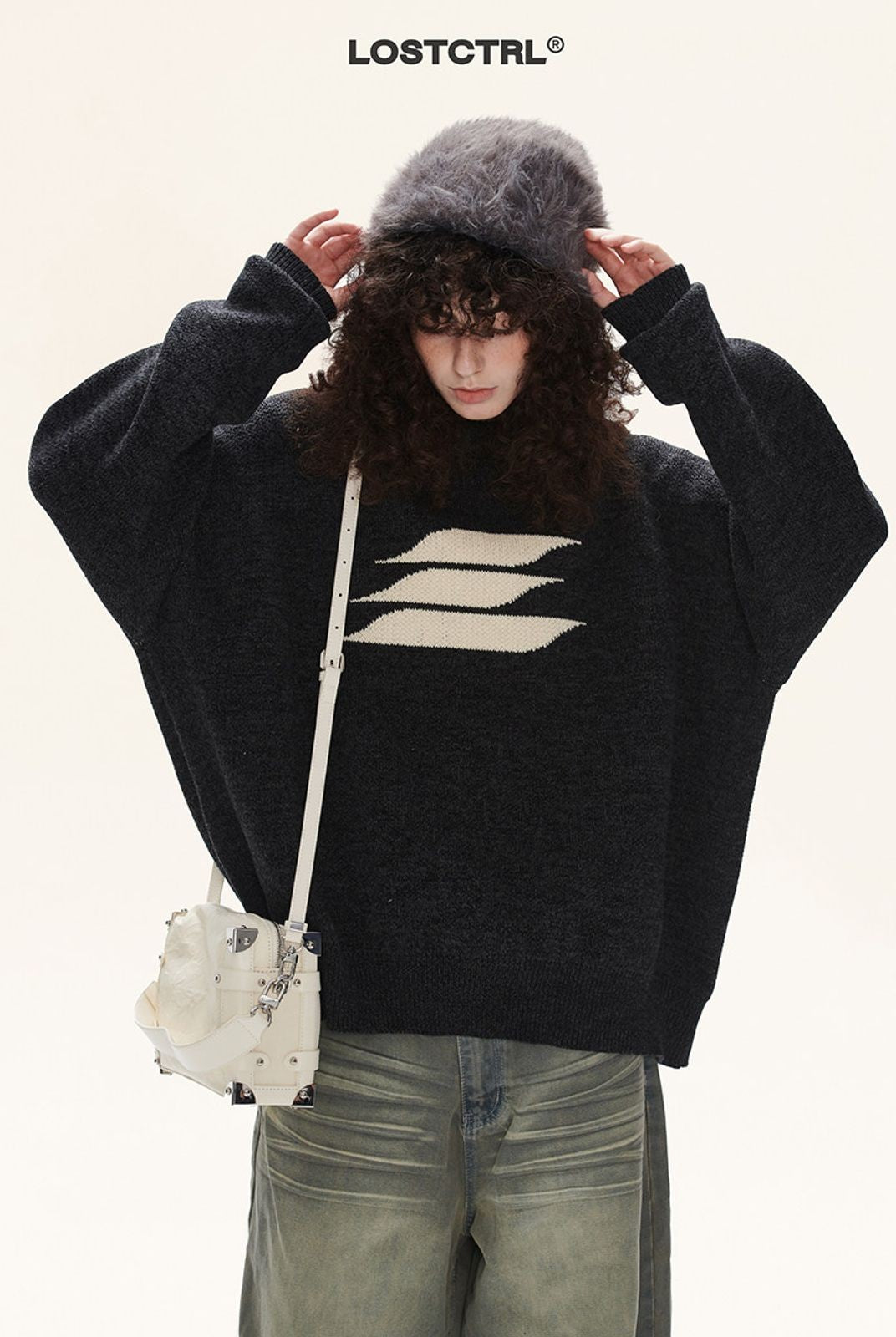 LOSTCTRL Abstract Logo Knit Sweater in Black - On Model