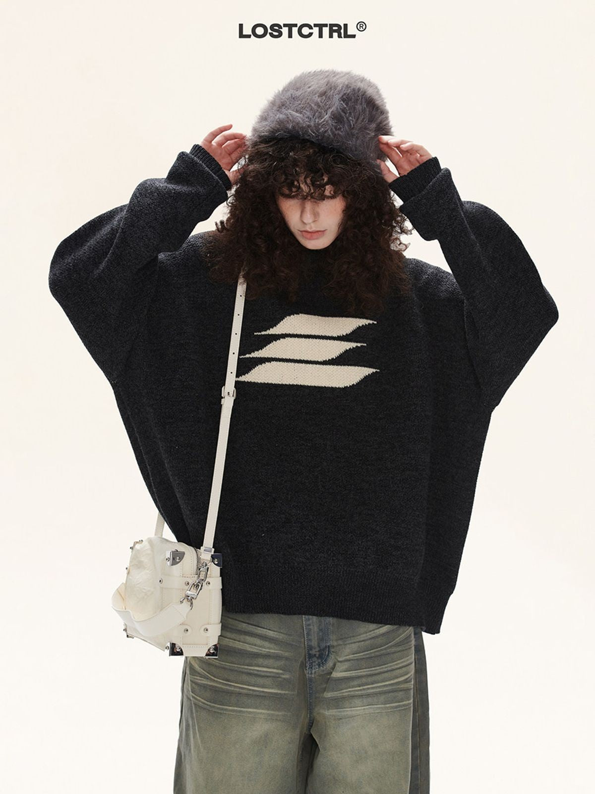 LOSTCTRL Abstract Logo Knit Sweater in Black - On Model