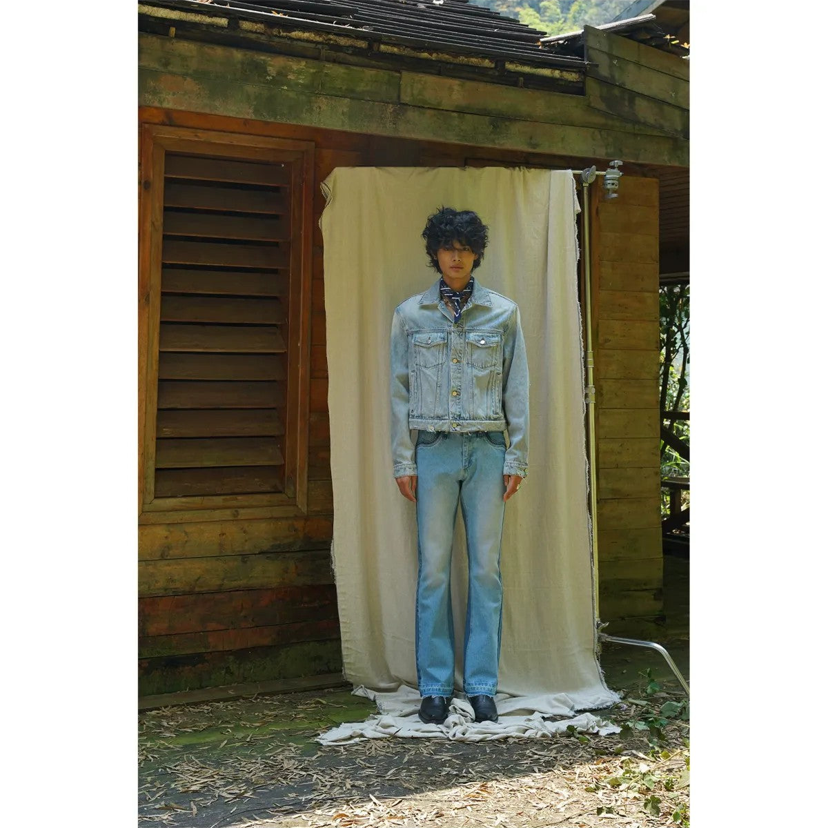 Retro 21 Distressed Denim Jacket with Shoulder Pads in Blue - On Model