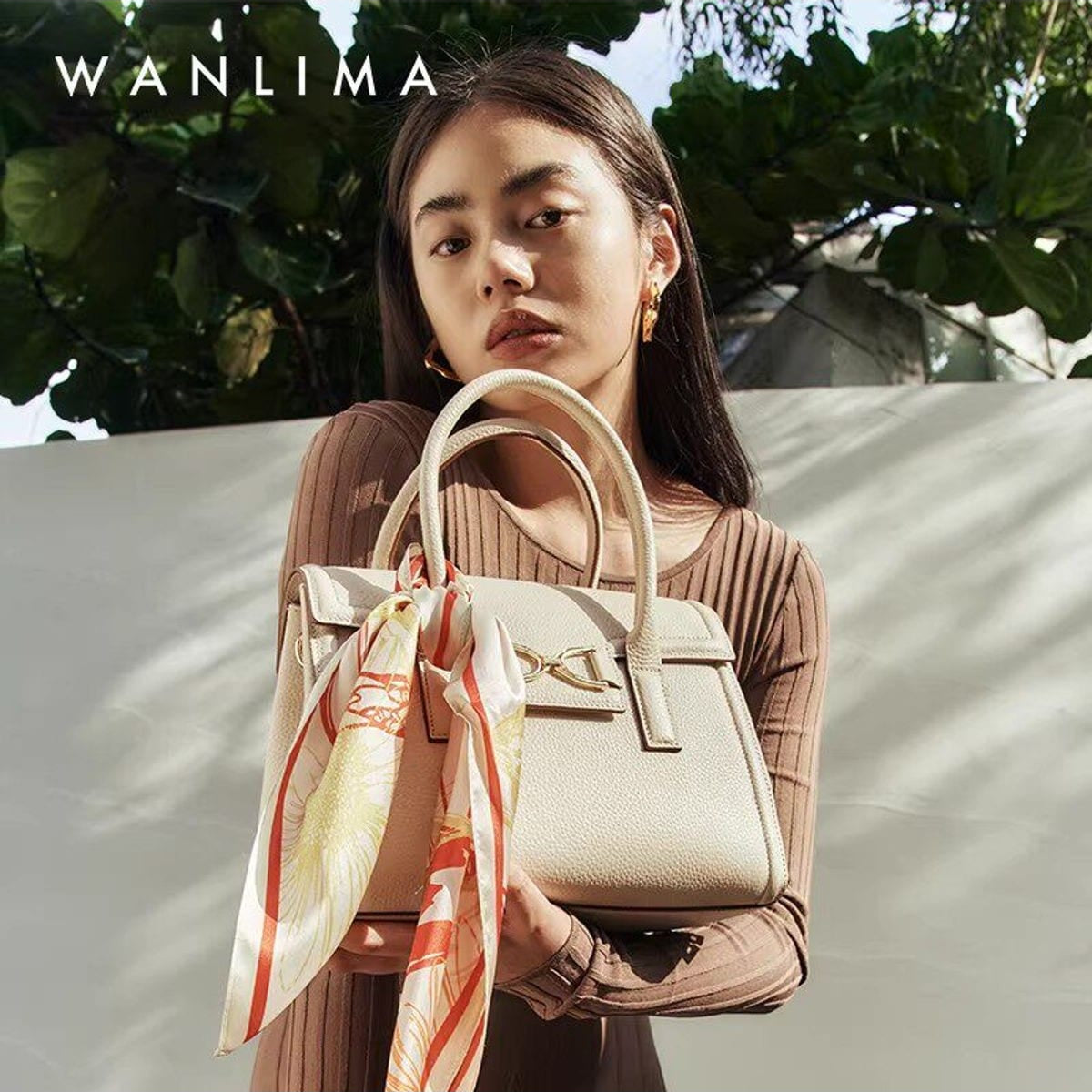 WANLIMA Cowhide Leather Top Handle Bag in White - On Female Model