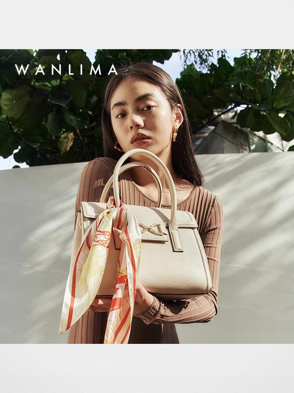 WANLIMA Cowhide Leather Top Handle Bag in White - On Female Model