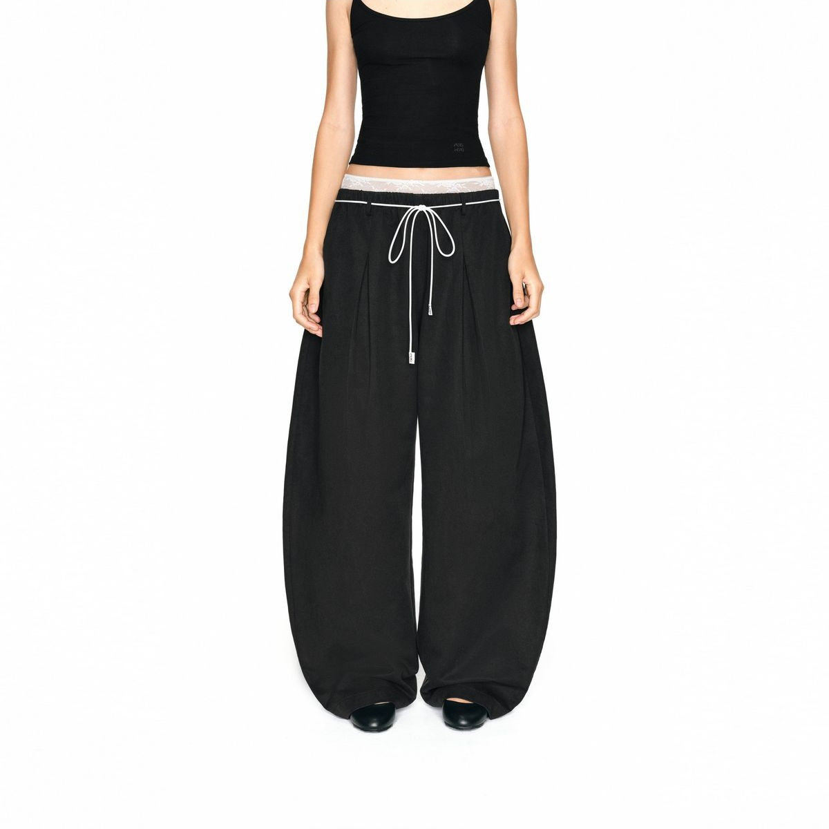 PUKI Lace Waistband Curved Leg Pants in Black - On Model