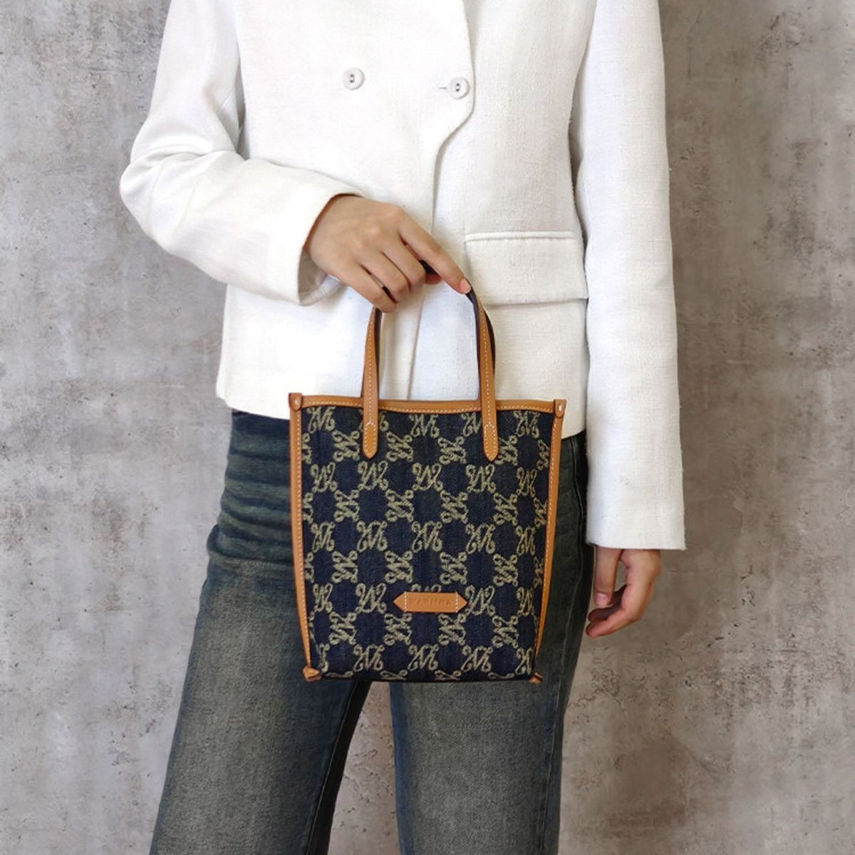 WANLIMA Leather Trimmed Monogram Denim Tote in Denim - On Female Model