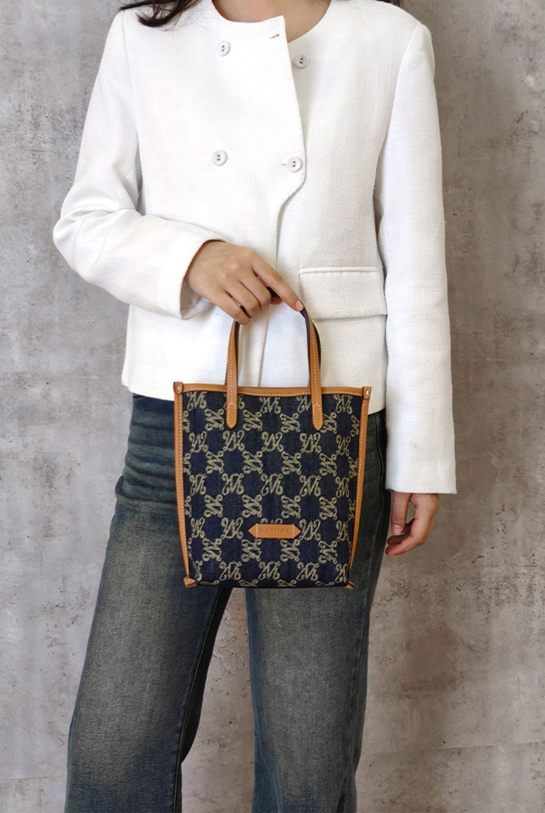 WANLIMA Leather Trimmed Monogram Denim Tote in Denim - On Female Model