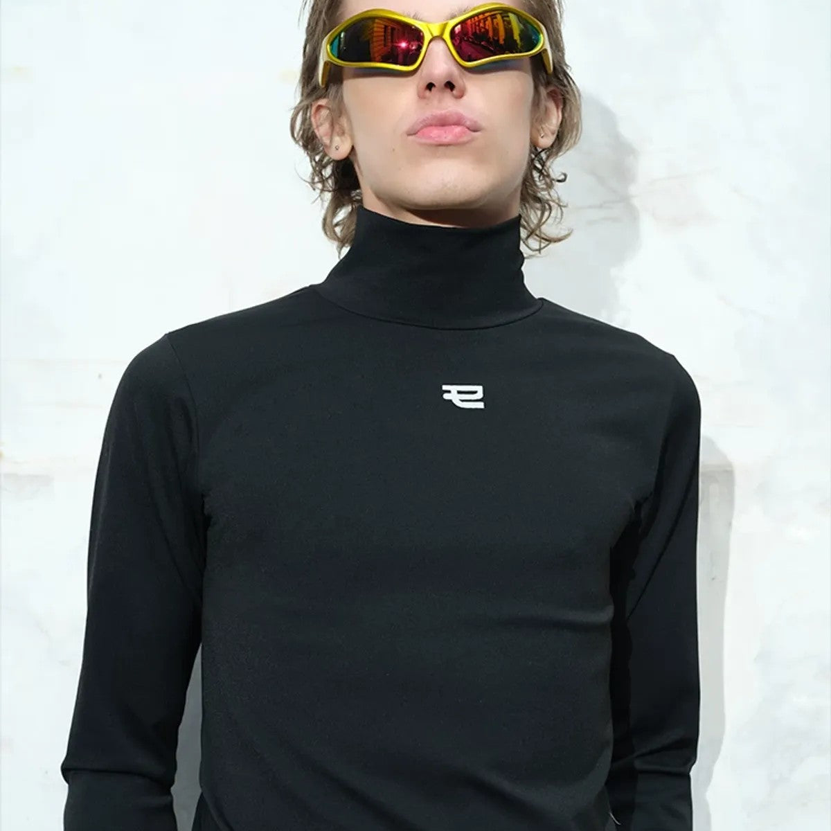 TRIANGLE PROJECT Logo High Neck Long Sleeve Top in Black - On Model