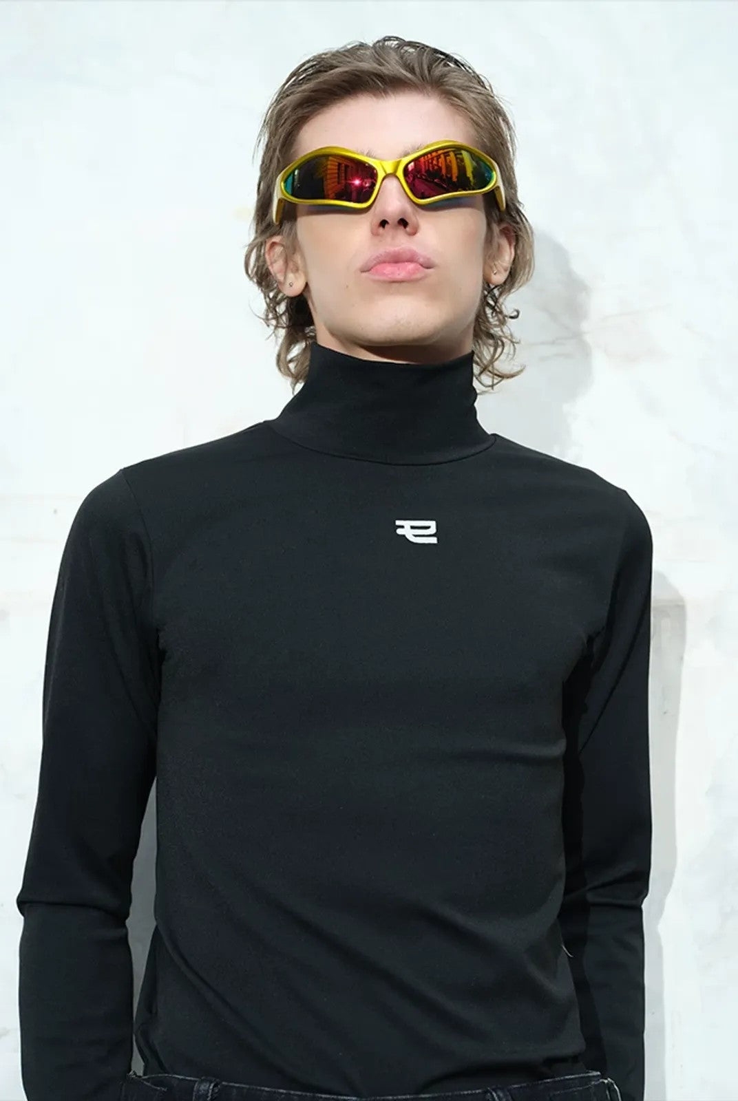 TRIANGLE PROJECT Logo High Neck Long Sleeve Top in Black - On Model