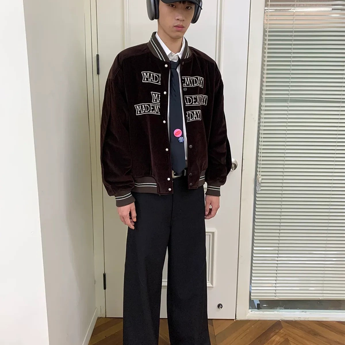 NeverSeez Velvet Corduroy Padded Varsity Jacket in Brown - On Model