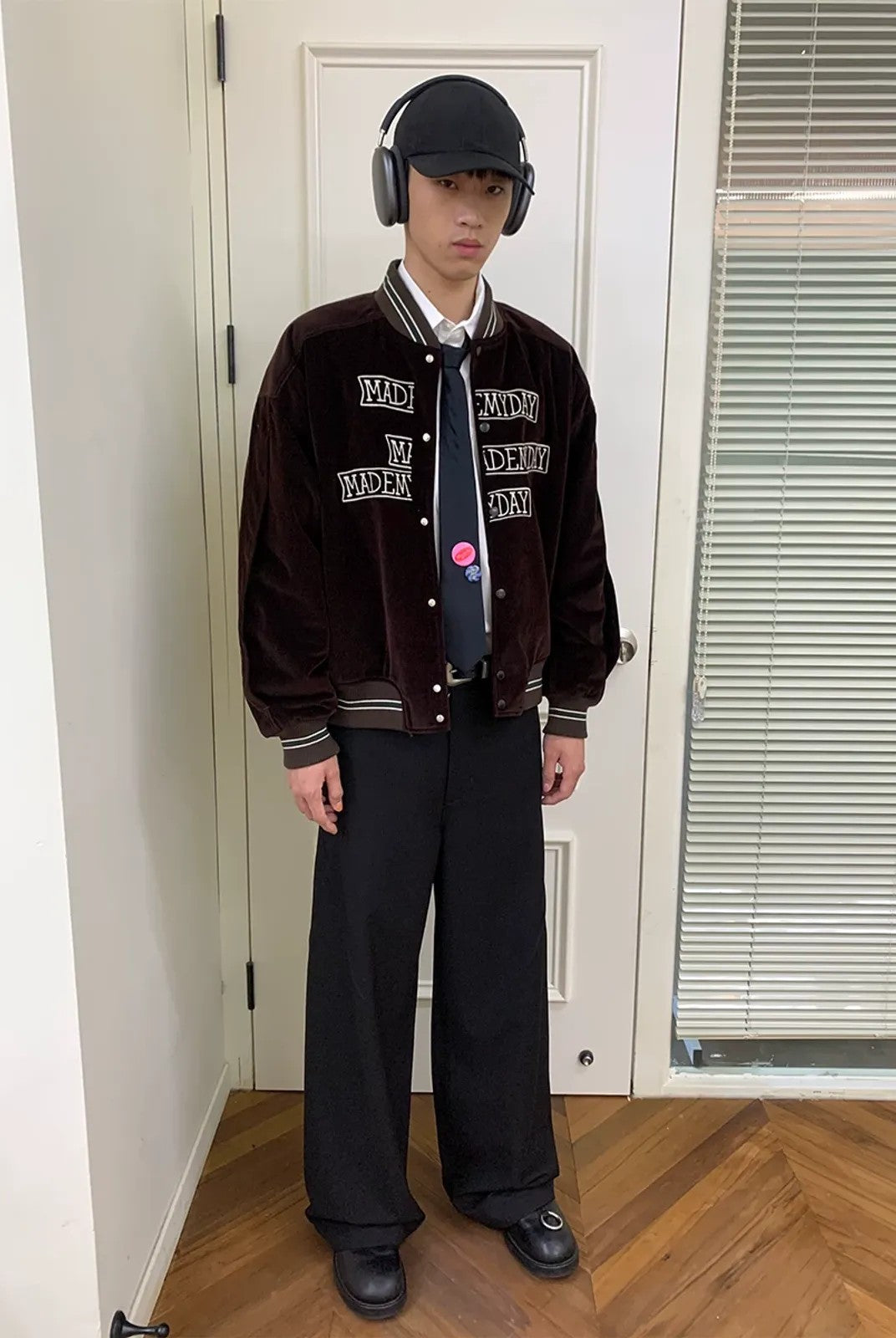 NeverSeez Velvet Corduroy Padded Varsity Jacket in Brown - On Model