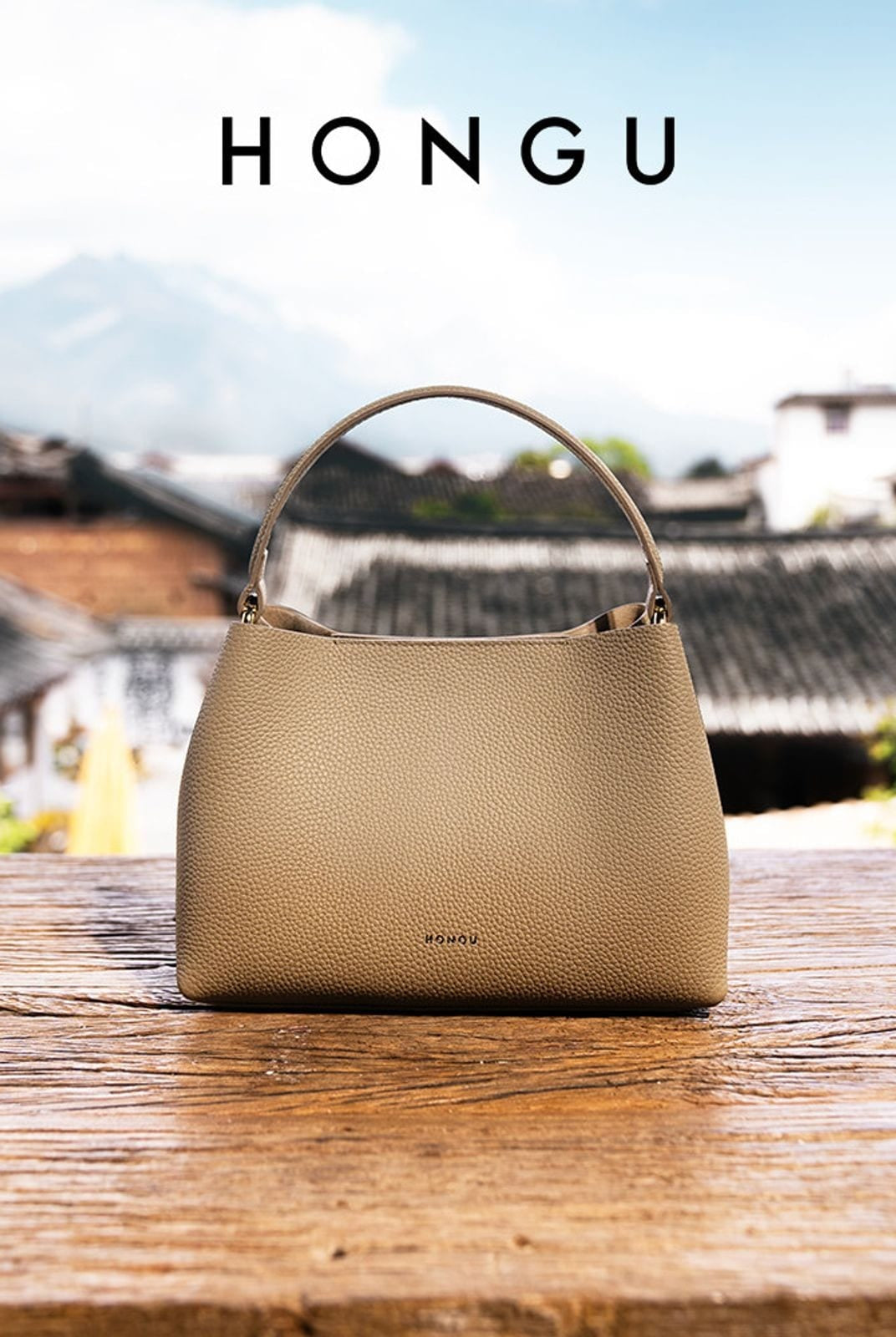 HONGU Textured Leather Top Handle Bucket Bag in Taupe - Lifestyle