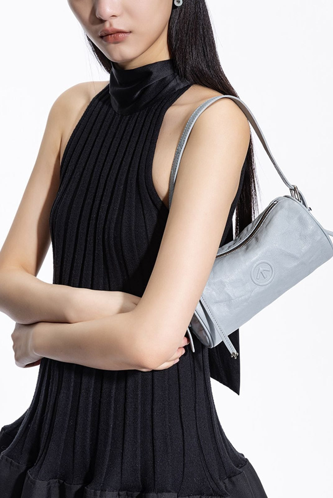 Grotto Pleated Leather Cylinder Bag in Sky Blue - On Female Model