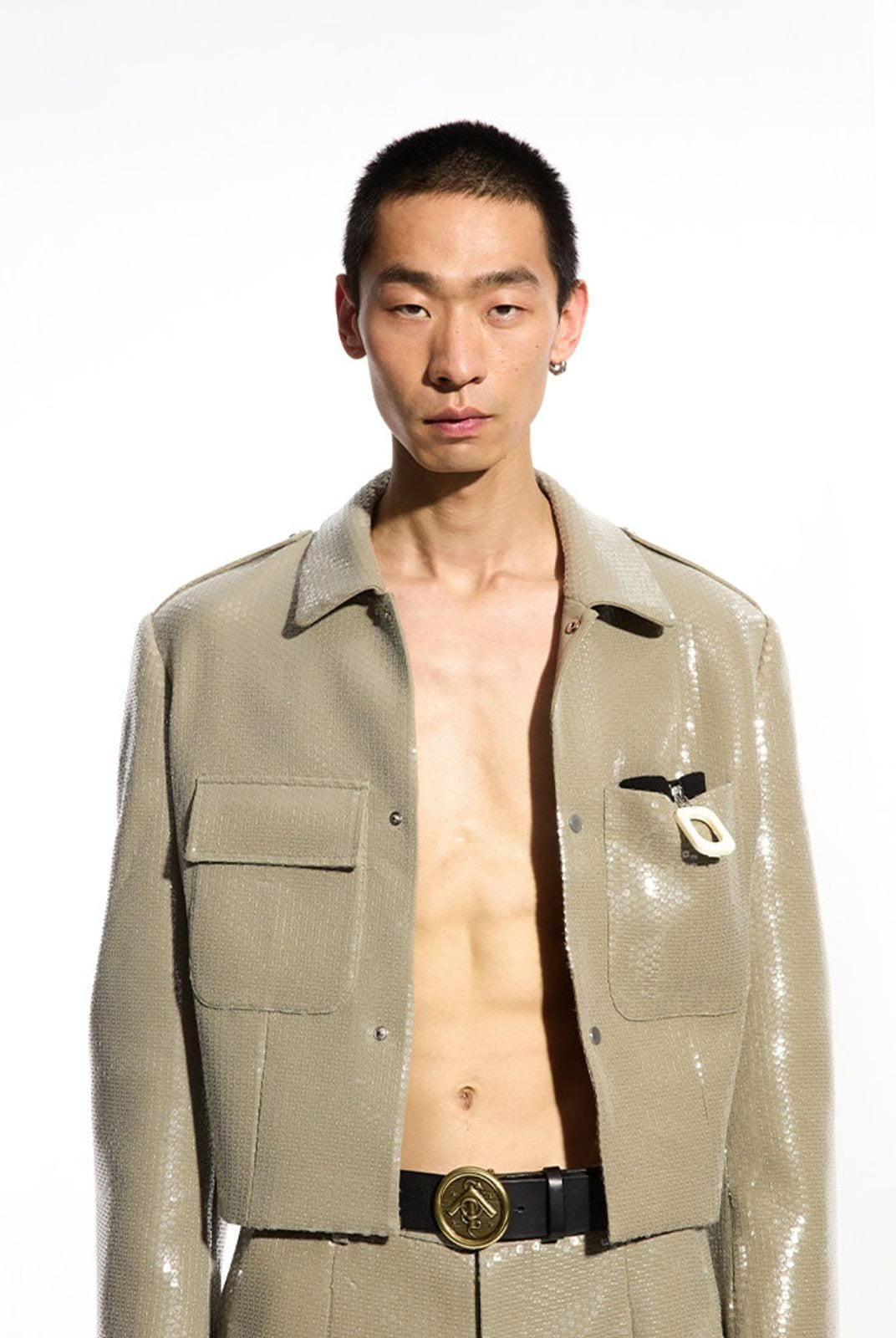 Grotto Arrow Logo Buckle Leather Belt in Black - On Male Model