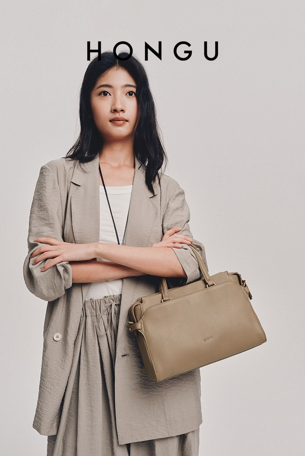 HONGU Cowhide Leather Top Handle Bag in Beige - On Female Model