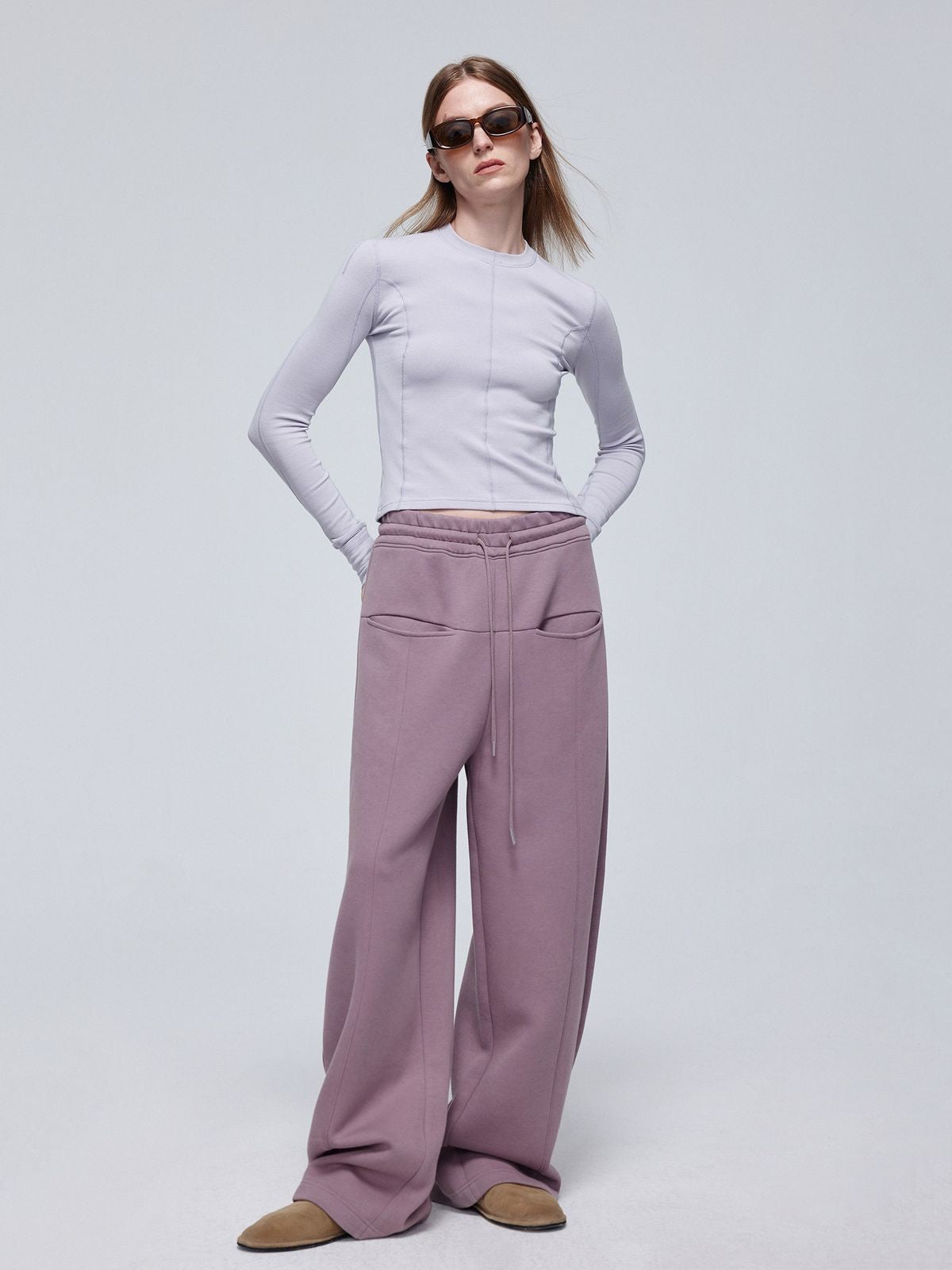 Simple Project Logo Embossed Wide Leg Sweatpants in Lavender - On Model