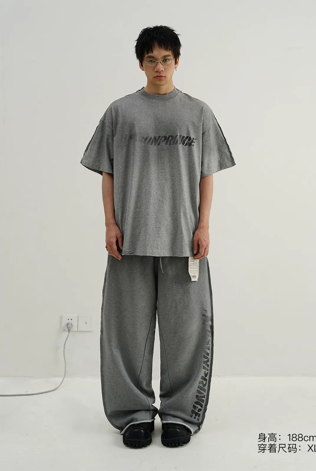 MASONPRINCE Distressed Spray Paint Logo Tee in Gray - On Model