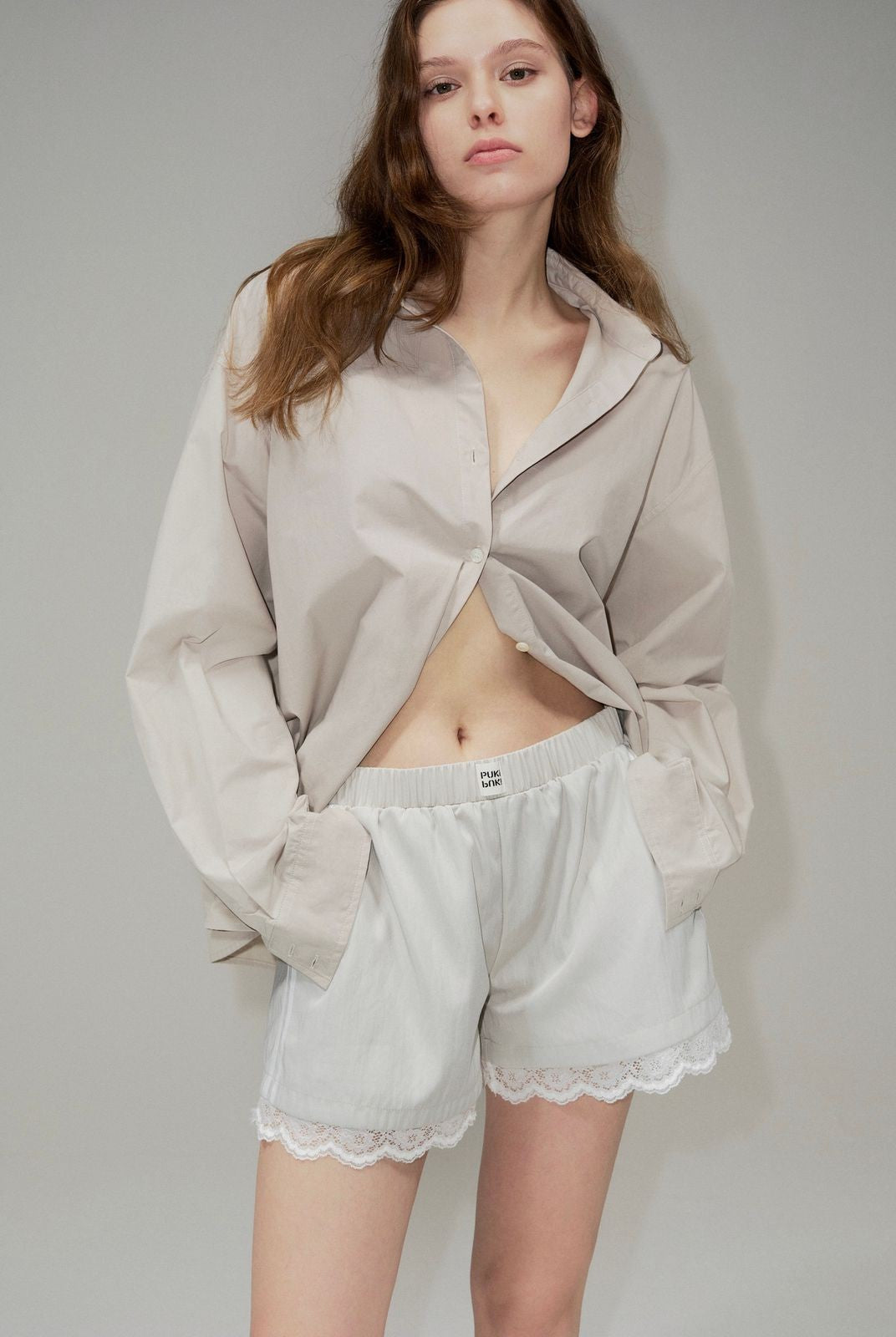 PUKI Lace Hem Track Shorts in Gray - On Model