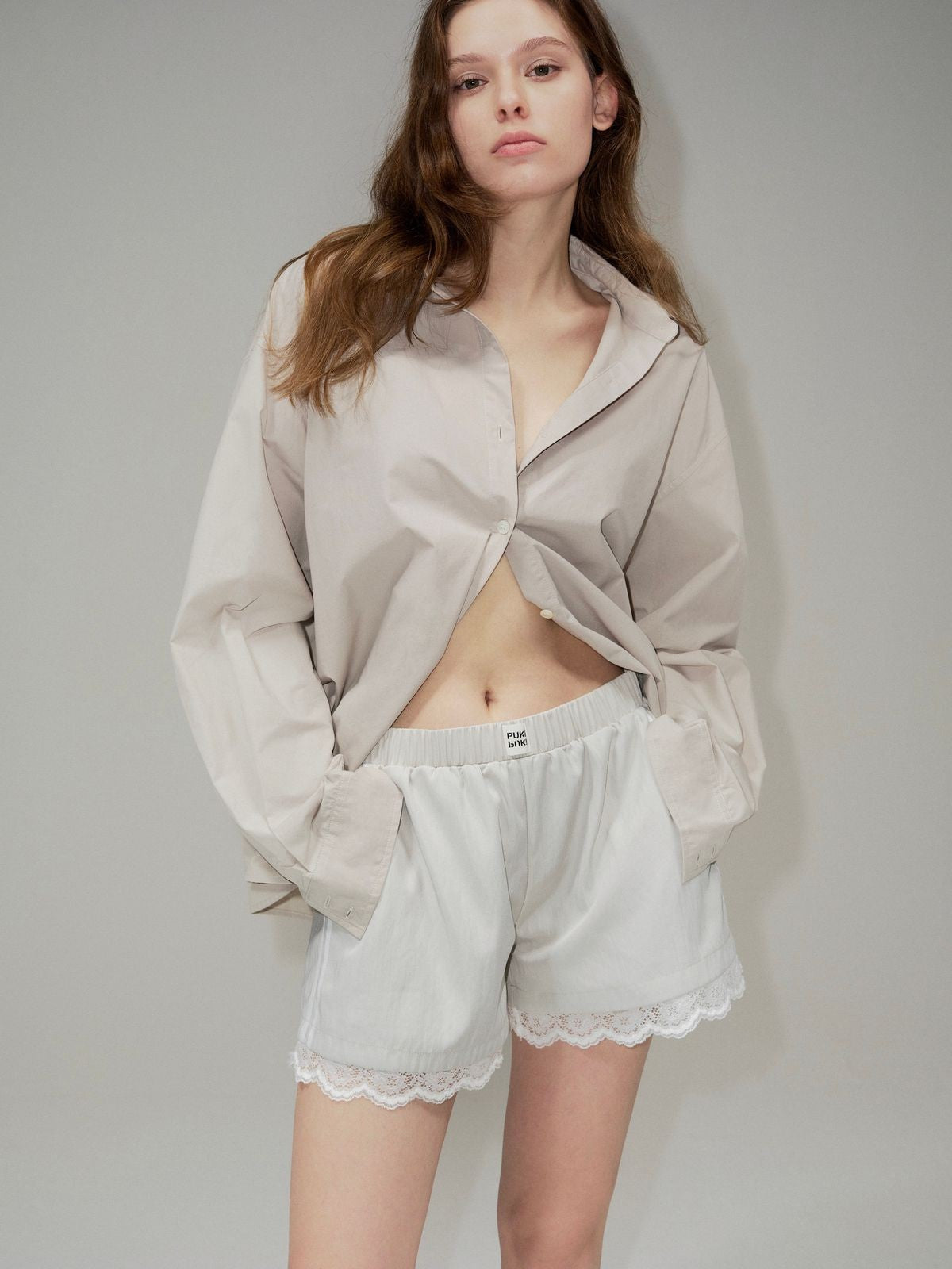 PUKI Lace Hem Track Shorts in Gray - On Model