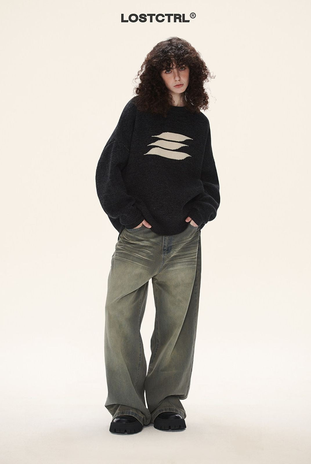 LOSTCTRL Abstract Logo Knit Sweater in Black - On Model