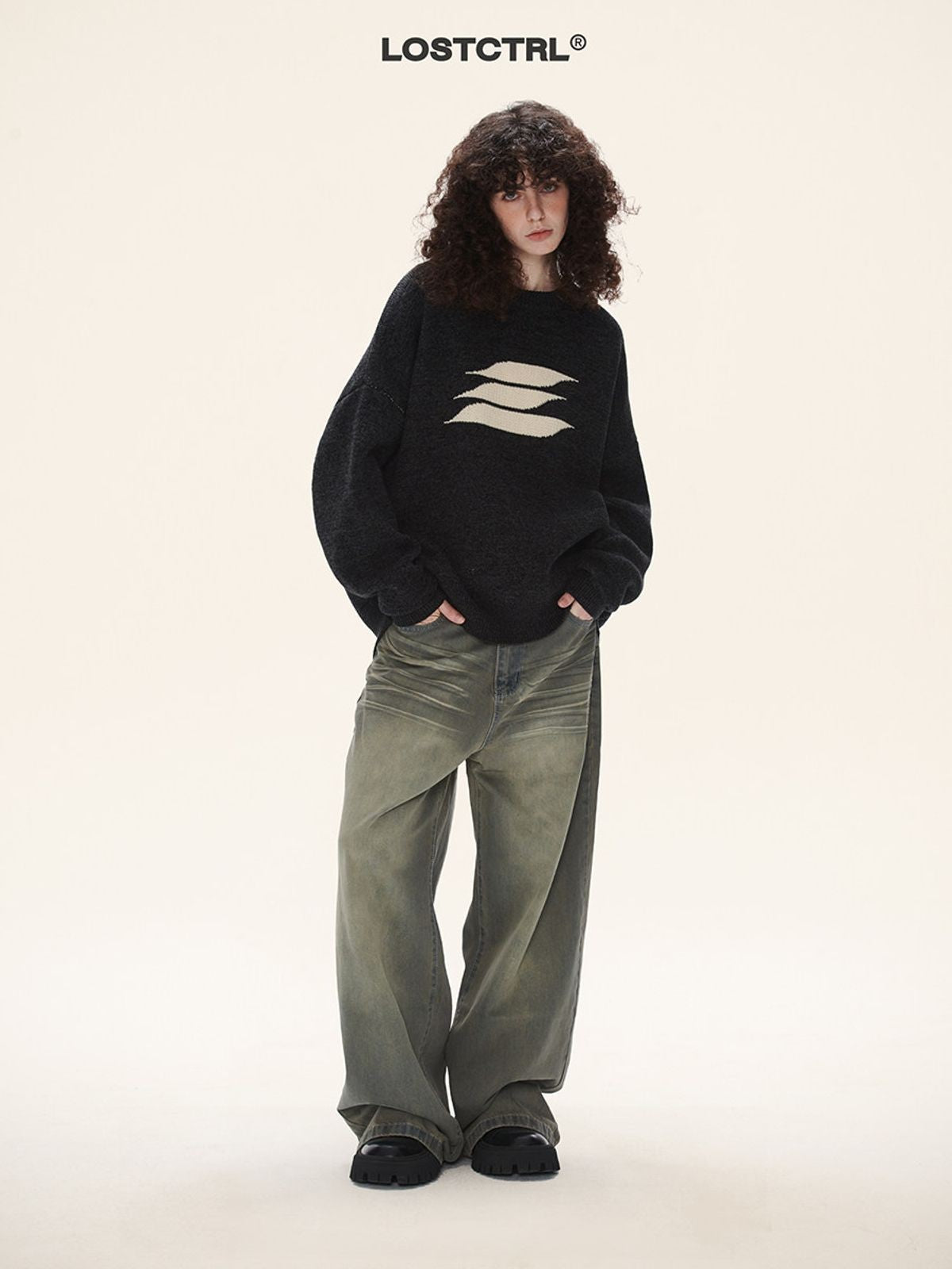 LOSTCTRL Abstract Logo Knit Sweater in Black - On Model