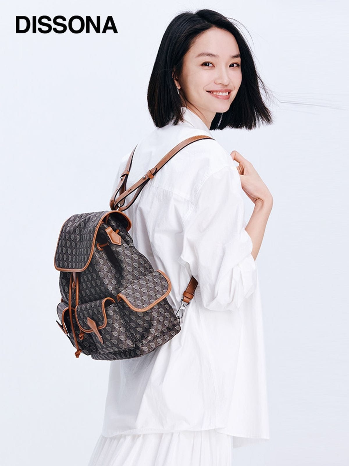 DISSONA Monogram Drawstring Backpack in Brown - On Female Model