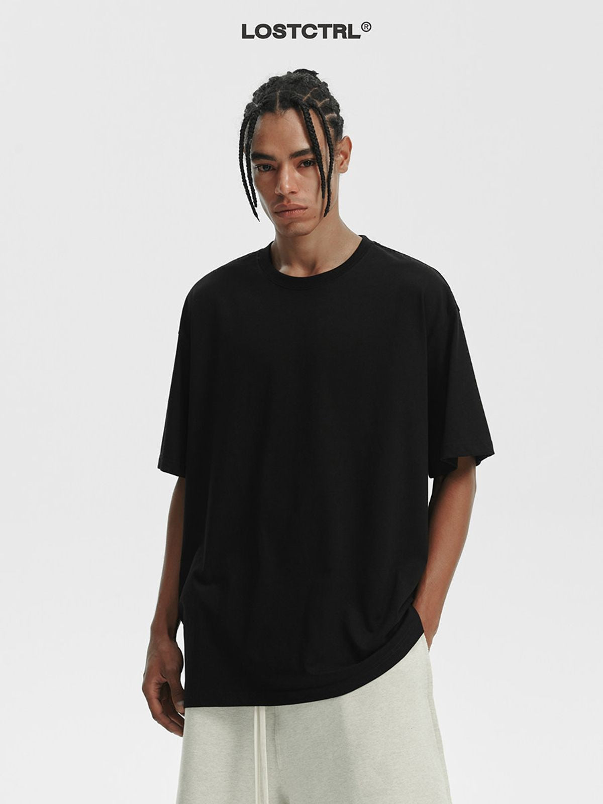 LOSTCTRL Loose Fit Cotton Crew Neck T Shirt in Black - On Model