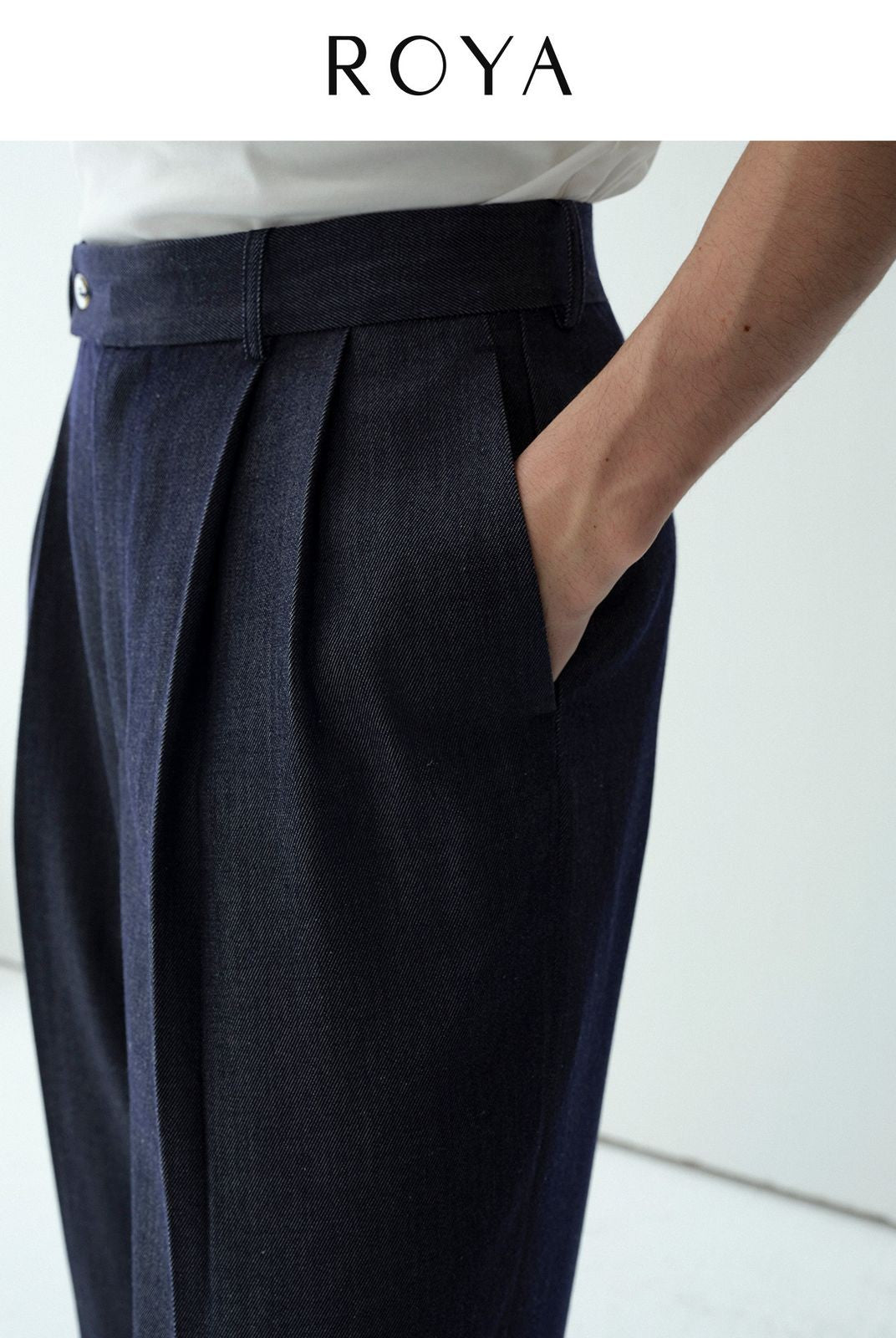 ROYA Pleated Silk Blend Denim Trousers in Blue - On Male Model