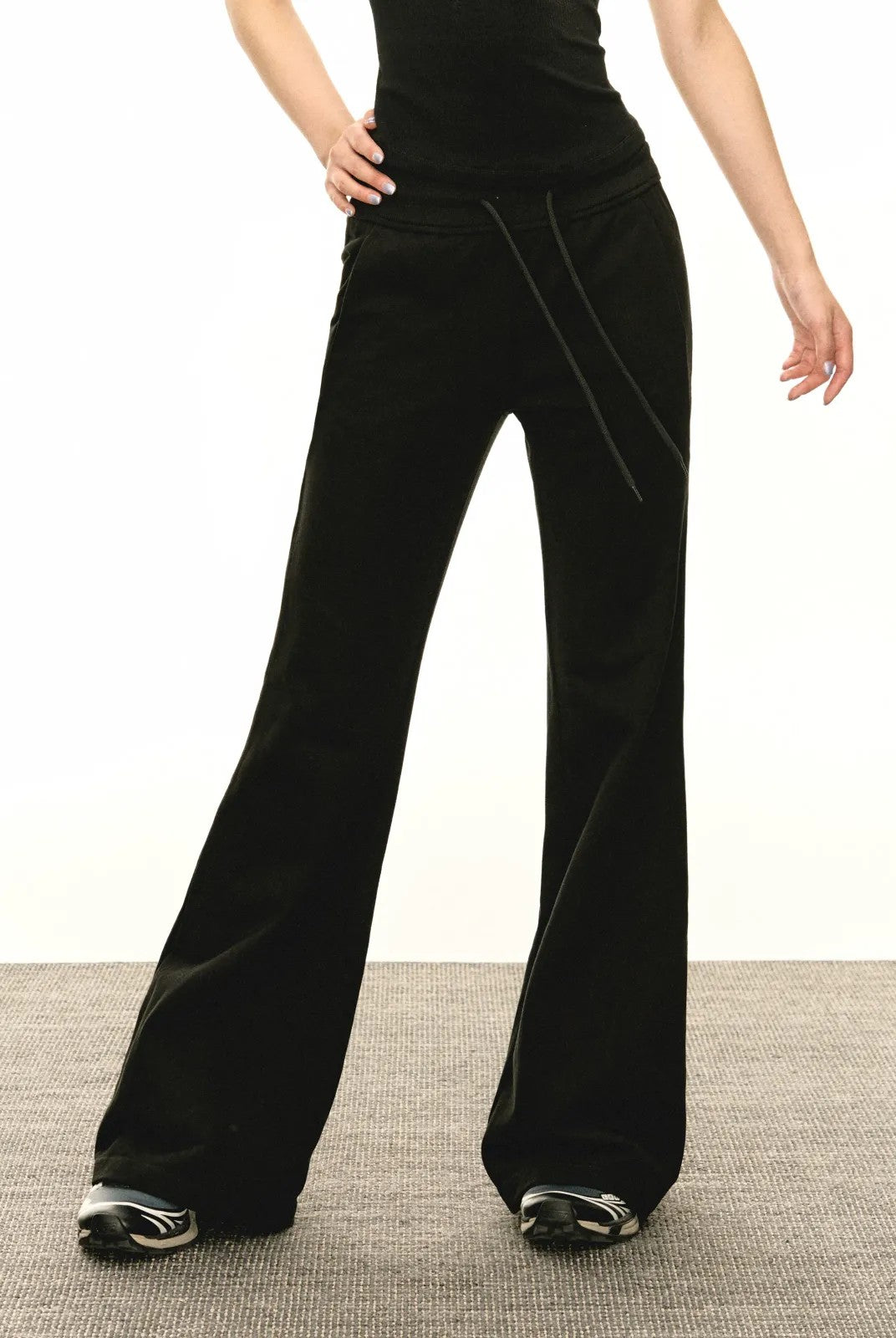 Ariseism Low Rise Micro Flare Sweatpants in Black - On Model