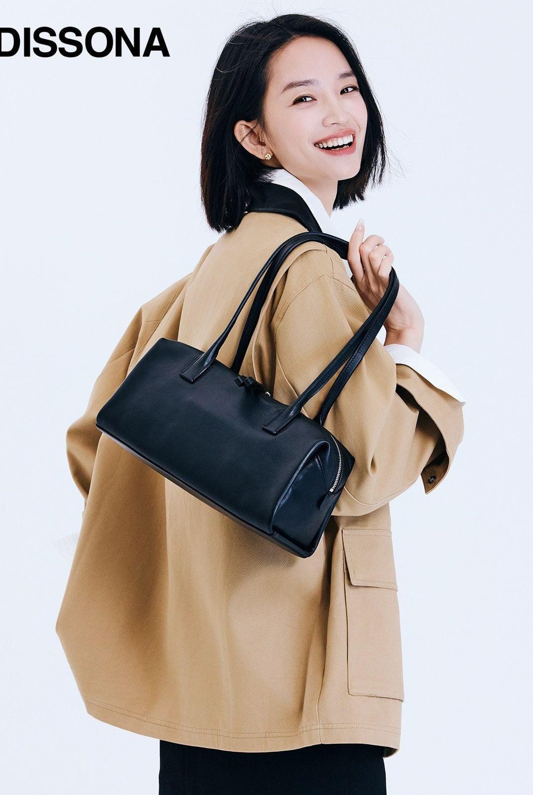 DISSONA Vegetable Tanned Leather Baguette Bag in Black - On Female Model