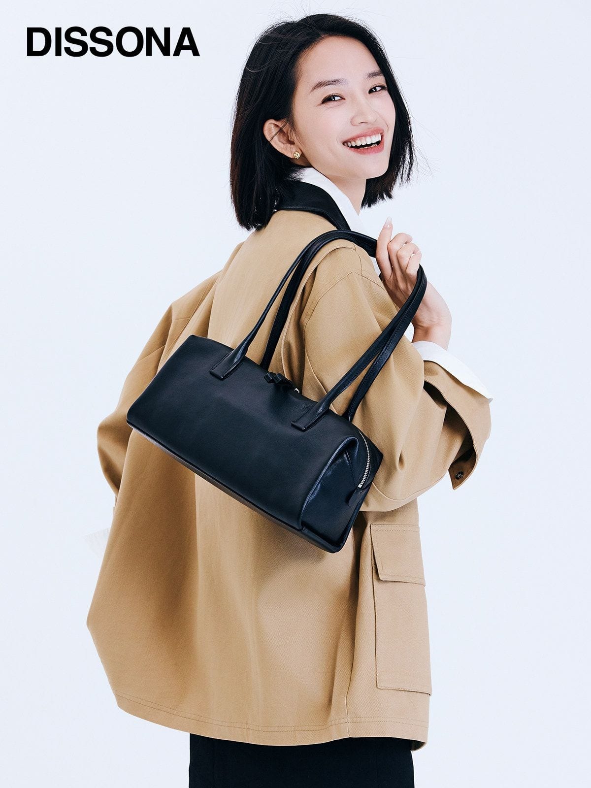 DISSONA Vegetable Tanned Leather Baguette Bag in Black - On Female Model
