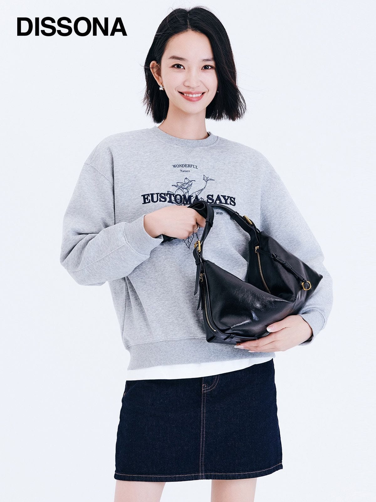 DISSONA Distressed Leather Crescent Hobo Bag in Black - On Female Model