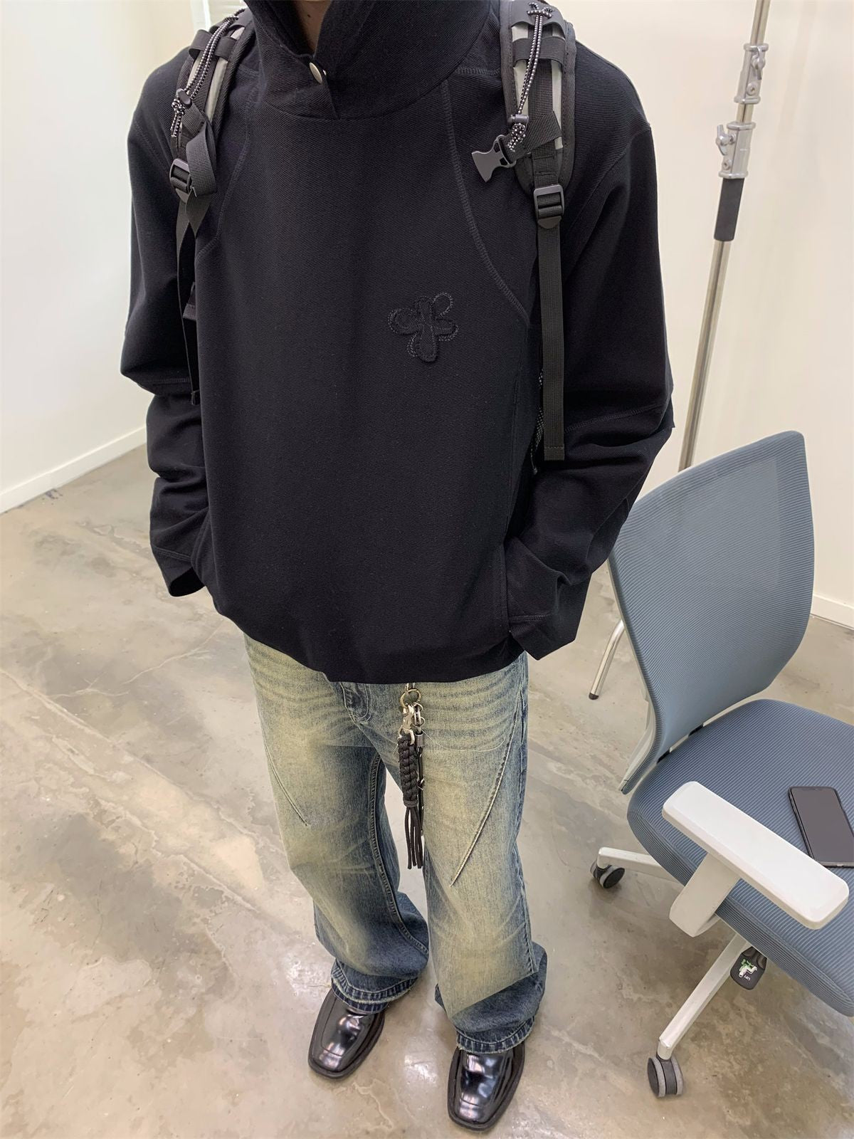 NeverSeez Distressed Washed Micro Flare Jeans in Blue - On Model