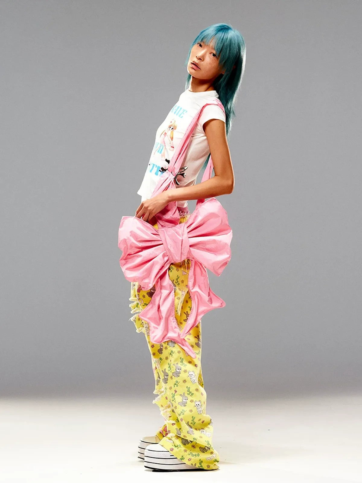 CFIERCE Nylon Bow Crossbody Bag in Pink - On Female Model