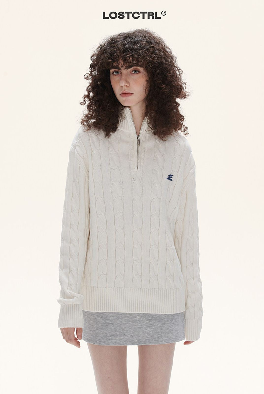 LOSTCTRL Half Zip Cable Knit Cotton Sweater in White - On Model